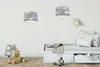 A child's bedroom with a bed, toy, and decorative items. Produktbild-Vorschau