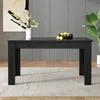A black rectangular dining table is shown in a room with a gray wall and a light gray rug. Anteprima dell’immagine prodotto