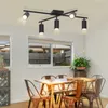 A dining room with a table, chairs, and a ceiling light. Náhled obrázku produktu