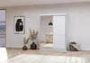 A modern bedroom or living room setting with a large white wardrobe with a mirrored door, decorative dried plants in vases, and a framed abstract artwork on the wall. Produktbild-Vorschau