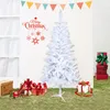 A white artificial Christmas tree is set up on a grassy surface, surrounded by wrapped gifts and Christmas decorations. Produktbild-Vorschau