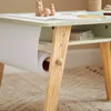 Close-up of a children's activity table with a roll of paper attached. Produktbild-Vorschau