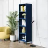 A dark blue bookshelf filled with books and decorative items, next to a yellow armchair and a large potted plant. Náhled obrázku produktu