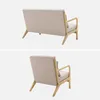 Two views of a beige sofa and armchair with wooden frames against a white background. Anteprima dell’immagine prodotto
