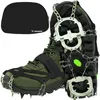 A pair of green hiking boots with metal spikes and chains attached to the soles, along with a black carrying case. Podgląd zdjęcia produktu