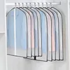 Several garment bags containing clothes are hanging on a closet rod. Produktbild-Vorschau