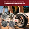 Close-up of an electric scooter wheel with four circular insets showing different types of paving surfaces. The text at the top promotes an innovative tire for a better riding experience. Produktbild-Vorschau