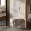 A modern bathroom with a wall-mounted toilet and marble accents. Podgląd zdjęcia produktu