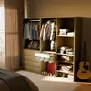 A modular wardrobe set with clothes, bags, and shoes arranged in a bedroom setting. Anteprima dell’immagine prodotto