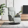 A light gray massage chair with a footrest is shown in a living room setting, with a plant and a TV stand in the background. Produktbild-Vorschau