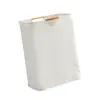 A white laundry basket with wooden handles on a white background. Náhľad obrázku produktu