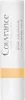 A white tube of concealer stick with text and a peach-colored band near the bottom. Produktbild-Vorschau