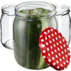 Three glass jars, one filled with pickles and the other two empty, with a red and white polka dot lid in the foreground. Anteprima dell’immagine prodotto