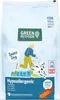 A bag of dog food with an illustration of a person and a dog. Voir les images du produit