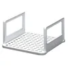 A white plastic food storage container with a perforated base and two upright handles. Voir les images du produit