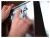 A person's hands are shown interacting with a metal filing cabinet or storage unit. Produktbild-Vorschau