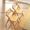 Two wooden folding chairs with rattan seats and backs are shown indoors. Podgląd zdjęcia produktu