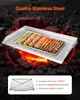 A stainless steel grill plate filled with skewers of food is placed over glowing coals and rocks. Produktbild-Vorschau