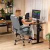 A woman is working at a desk in a home office setting. Produktbild-Vorschau