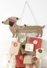 A handmade advent calendar shaped like a dachshund, with small paper bags hanging from its belly. Anteprima dell’immagine prodotto