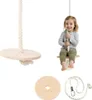 A child is sitting on a wooden swing, with other parts of the swing shown separately. Podgląd zdjęcia produktu