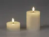 Two LED candles of different sizes are shown against a plain gray background. Produktbild-Vorschau