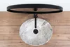 A top-down view of a grey marble oval basin with a black faucet, mounted on a wooden wall. Podgląd zdjęcia produktu
