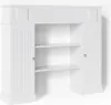 A white fireplace surround with shelving and two cabinet doors. Náhled obrázku produktu