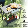 A grill cart with food and ingredients on it, set up on a grassy lawn. Produktbild-Vorschau