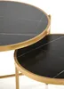 Close-up view of two round nesting tables with black marble tops and gold metal frames. Podgląd zdjęcia produktu