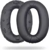 Two black ear pads for headphones are shown against a white background. Voir les images du produit