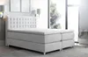 A modern bedroom with a large bed and a window. Náhled obrázku produktu