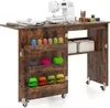 A sewing table with a sewing machine and various sewing supplies.