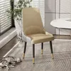 A dining chair in a well-lit room with a cat sleeping on the rug. Podgląd zdjęcia produktu