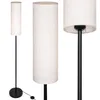 Three views of a tall, cylindrical floor lamp with a white linen-like shade and a black metal stand and base. Náhľad obrázku produktu