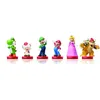 A collection of Nintendo amiibo figures from the Super Mario series, displayed on a white background. Produktbild-Vorschau
