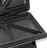 A close-up view of the interior of an open sandwich toaster, showing the non-stick cooking plates. Produktbild-Vorschau