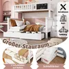 A white bunk bed with drawers and a chalkboard on the top bunk, set in a child's bedroom. Produktbild-Vorschau