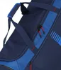 Close-up view of a navy blue travel bag with blue accents and red zipper pulls. Náhled obrázku produktu