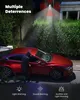 A person in a hoodie is attempting to break into a red car at night, while a security camera on a pole illuminates the scene and emits red warning signals. Produktbild-Vorschau