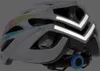 A white bicycle helmet with colorful accents and reflective stripes. Náhľad obrázku produktu