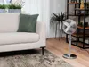 A living room scene with a sofa, a fan, and plants. Produktbild-Vorschau
