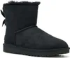A black Ugg boot with a bow on the back, shown from the side on a white background. Produktbild-Vorschau