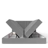 A grey upholstered bed frame with the storage compartments open, revealing the internal mechanism and storage space. Produktbild-Vorschau