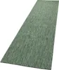 A long, narrow green rug is shown from a diagonal angle against a white background. Produktbild-Vorschau