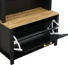 A close-up view of a black and wood-toned cabinet with two open shoe compartments, each with a white plastic shoe rack. Voir les images du produit
