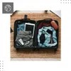 Packed suitcase with travel essentials. Podgląd zdjęcia produktu