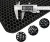 A close-up view of a black honeycomb-patterned mat, with a digital caliper measuring its thickness. Three circular insets show magnified views of the mat's texture. Náhled obrázku produktu