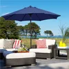 An outdoor patio scene with furniture and a large umbrella. Produktbild-Vorschau