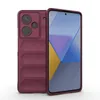 A burgundy phone case is shown next to a smartphone with a colorful abstract wallpaper. Produktbild-Vorschau